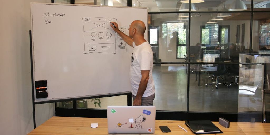 software development team analyzing data on computer screens in modern office