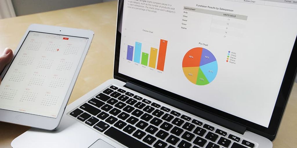business analysis charts and diagrams on a desk with people discussing in a modern office