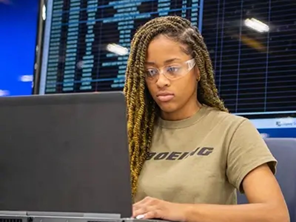 cloud support engineer working on laptop